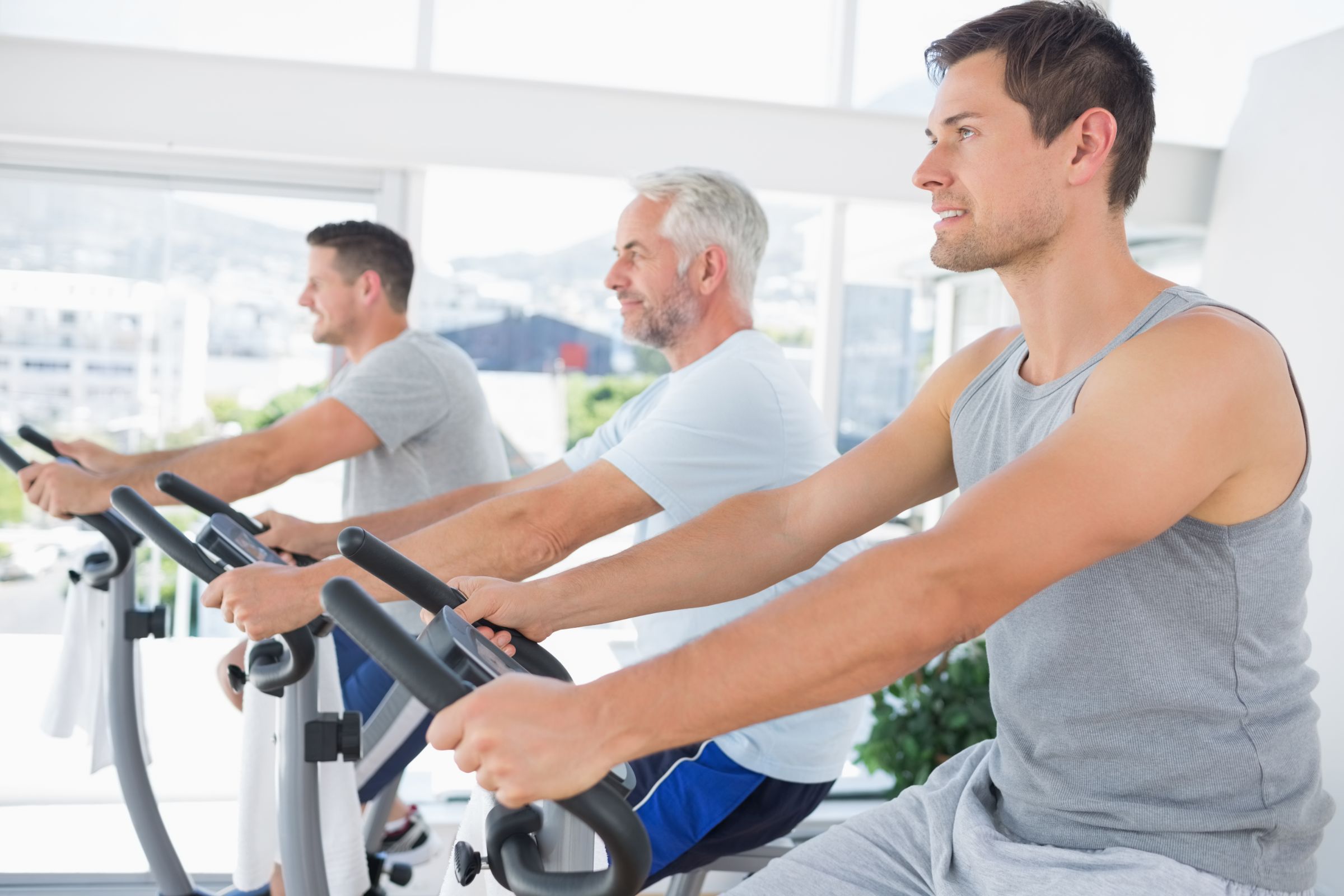 Men Working Out Exercise Machines